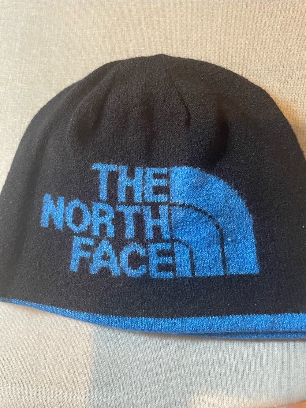 The North Face Kids Black Beanie with Blue Logo Trim - Reversible
